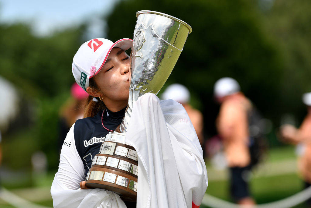 Ayaka Furue poses with the Evian Championship trophy